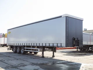 Шторный полуприцеп Orthaus